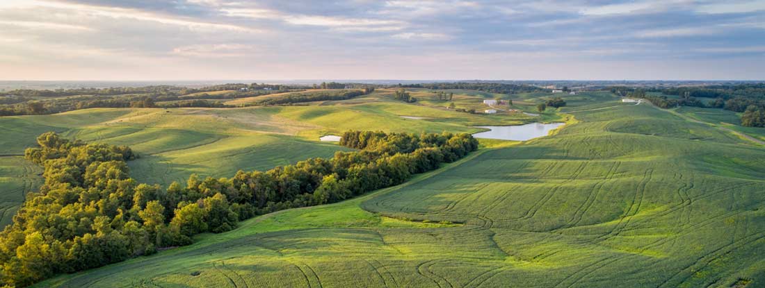 Scenic agricultural landscape with rolling green hills. Missouri State Laws and Regs.