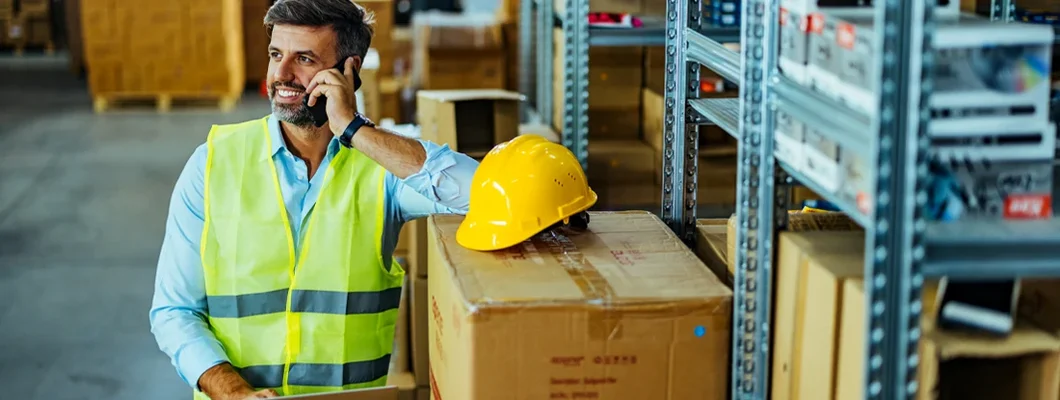 Engineer using a smartphone in an industrial place of work. How to Find the Best Business Insurance in Mount Lebanon, Pennsylvania.