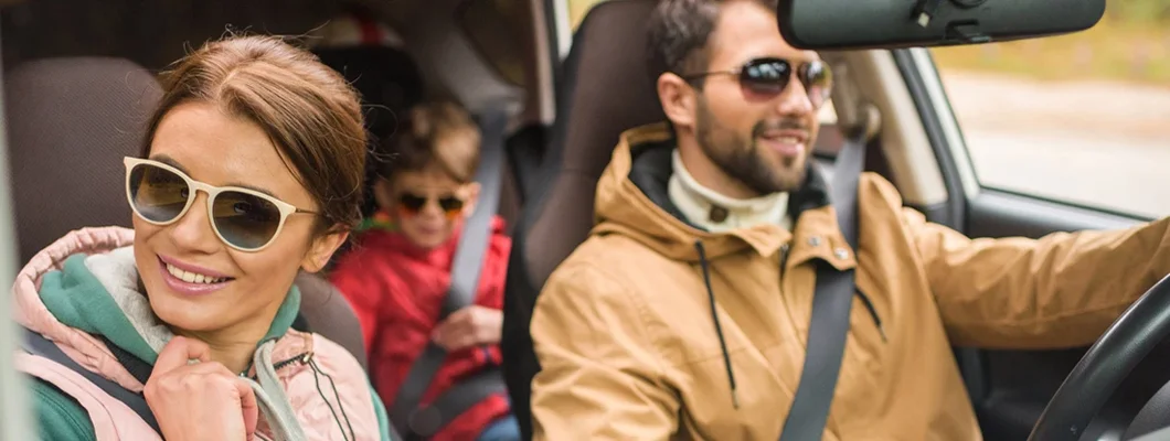 Family traveling by car on rural road. How to Find the Best Car Insurance Policy in Papillion, Nebraska.