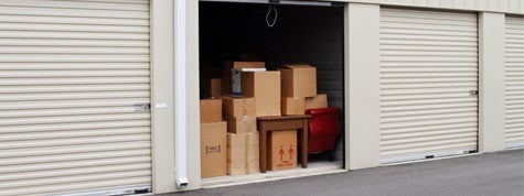 Self storage warehouse with single storage unit open