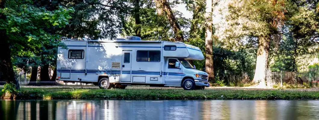 Family trip in motorhome in forest in Maine. Find Maine RV Insurance.