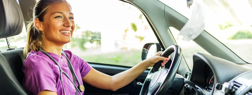 Nurse driving home after a day's work. How to Find the Best Car Insurance in Jericho, New York. 