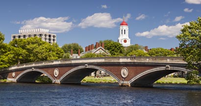 The dome of Harvard University's Dunster House and John W. Weeks Bridge over Charles River in Cambridge Massachusetts
