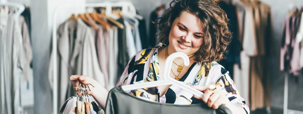 Store owner choosing a dress for customer. Business Insurance in Dublin, Ohio.