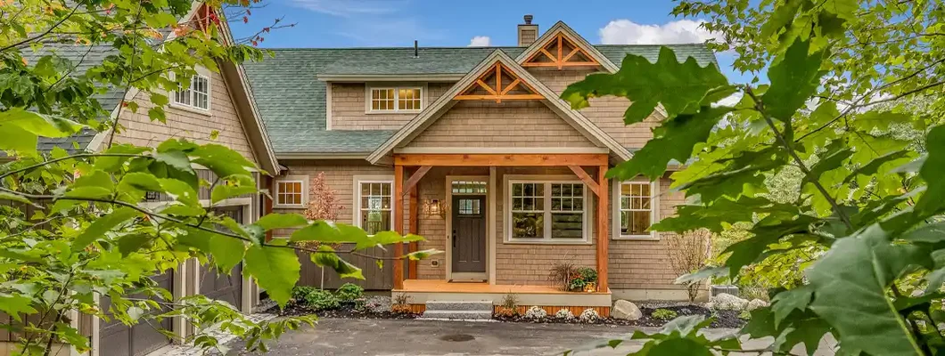 New home being viewed from the trees. Montpelier, Vermont Homeowners Insurance. 