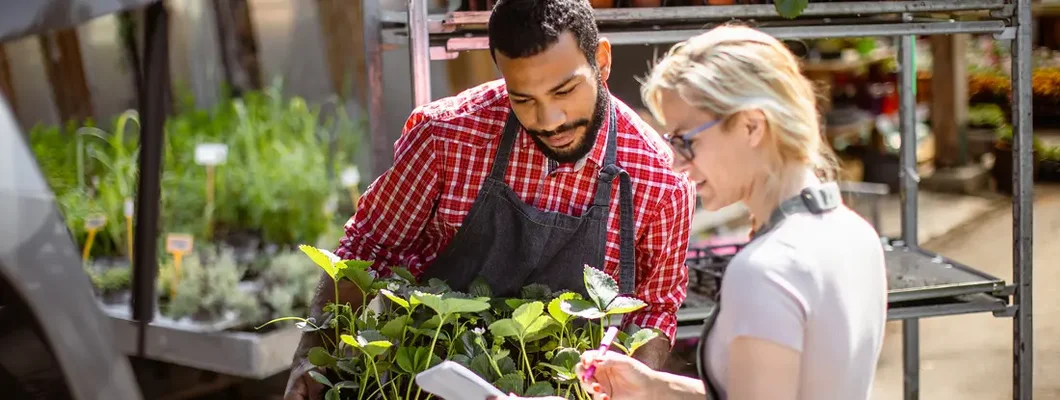 Garden center workers transporting plants in a van. Find Bethany, Oregon business insurance.