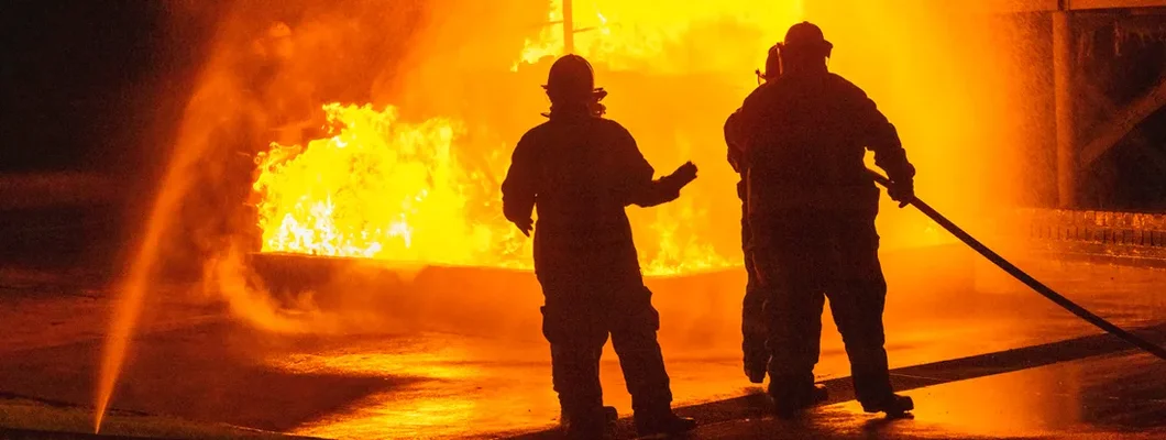 Firefighters extinguish the huge fire. Find Fire Legal Liability Insurance.