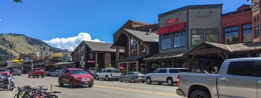 Street with old houses, bicycles and cars. Jackson, Wyoming Car Insurance.