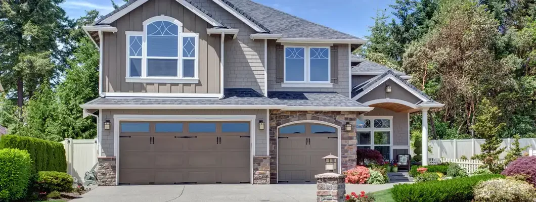 Home exterior with garage and driveway. Broadview Heights, OH Homeowners Insurance.