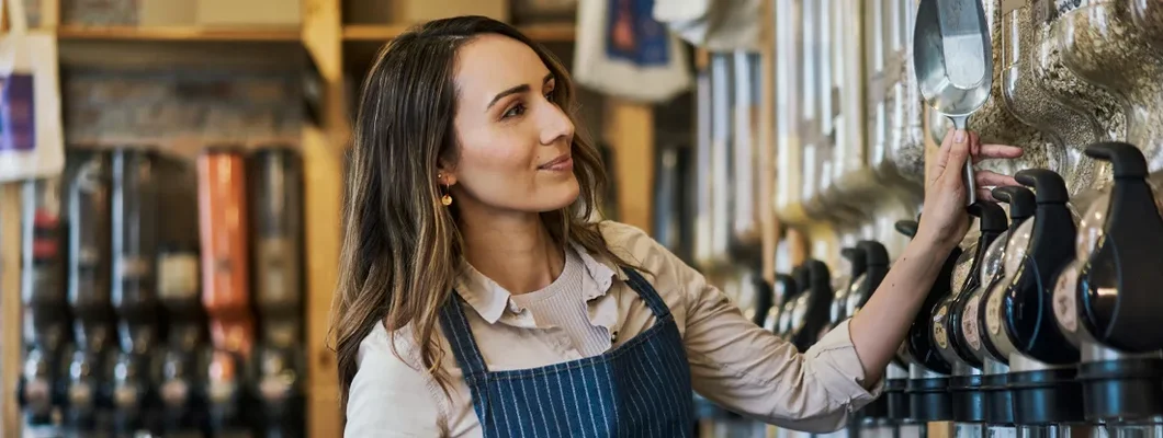 Store owner checking the stock levels on the shop. Business Insurance in Montpelier, Vermont.