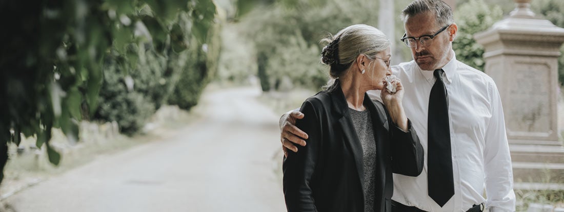 Husband trying to comfort his wife due to her loss. Workers Comp Death Benefits.