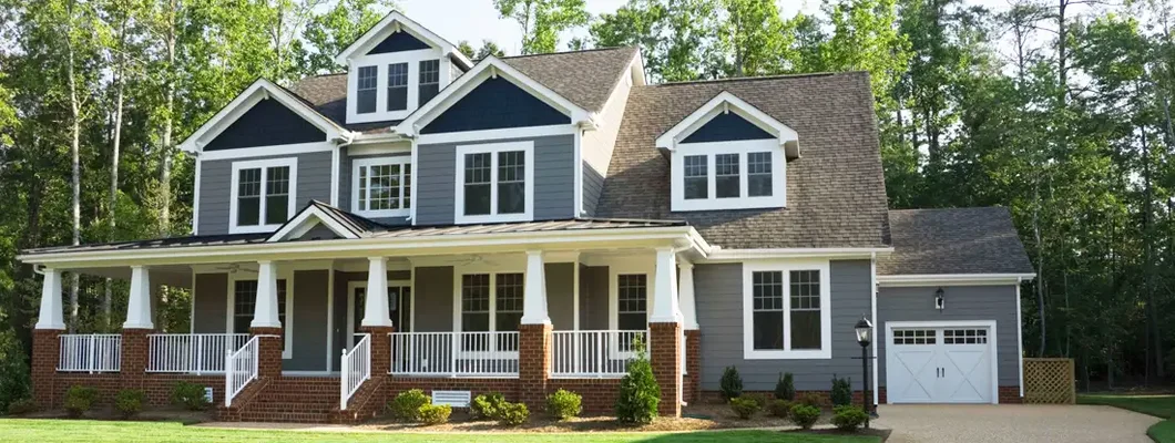 Exterior of house in suburbs. How to Find the Best Homeowners Insurance in Papillion, NE.