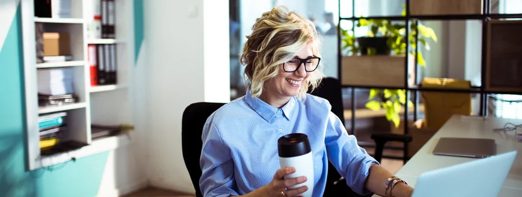 Female office worker working on a project. How to Find the Best Business Insurance in Augusta, Maine. 