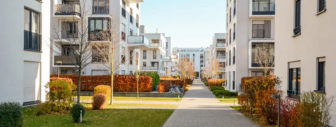 Cityscape with residential buildings in late autumn. Find Iowa Condo Insurance.