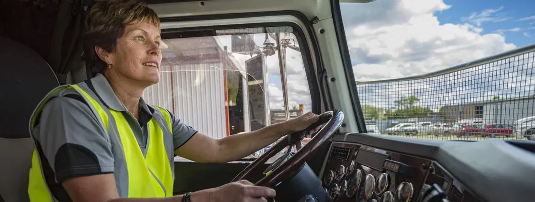 Woman Driving a Company Truck. Find North Dakota Commercial Vehicle Insurance. 