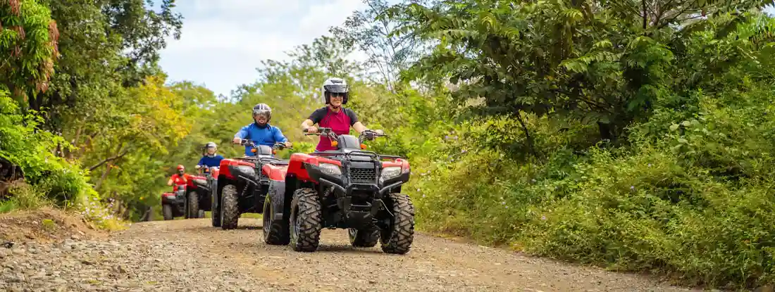 Group of tourists driving ATVs. Find ATV Insurance Claims.