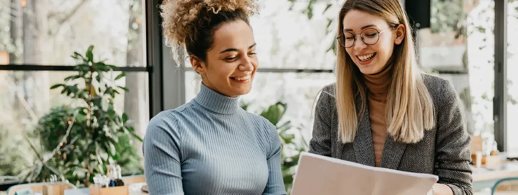 Women having a quick casual business meeting in a cafe. Find Stone Ridge, Virginia business insurance.