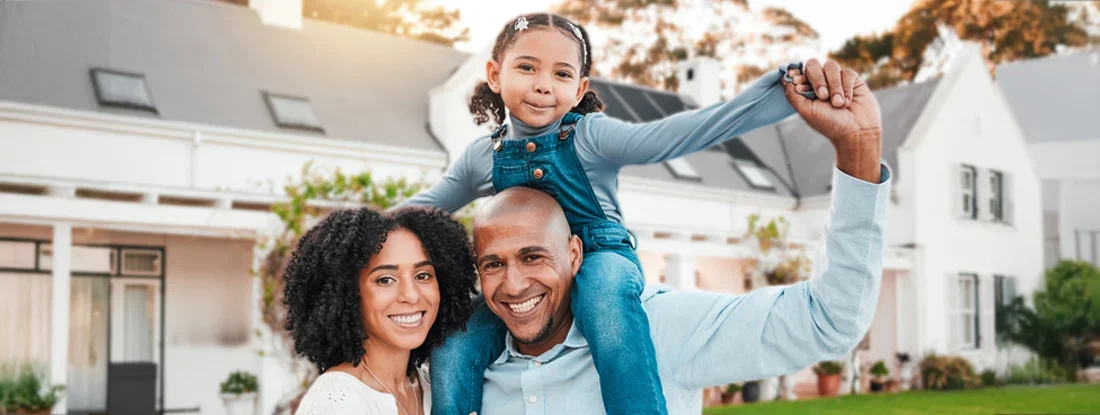 Family in front of new home. What You Didn't Know About Buying a House 'As Is'.