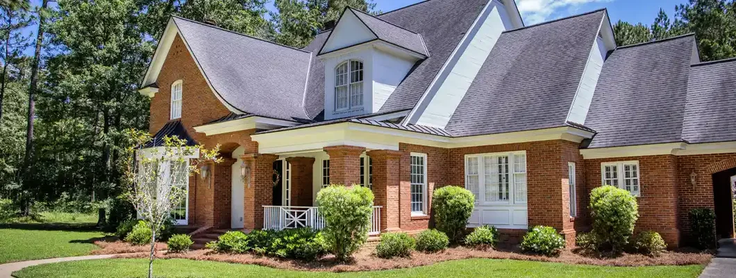Exterior of Red Brick Traditional Southern Home. How to Find the Best Homeowners Insurance in Bixby, OK.