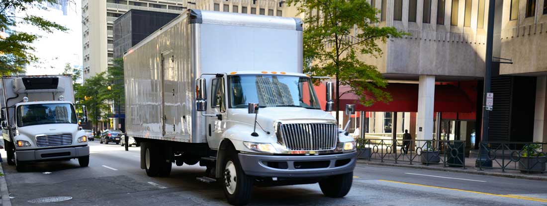 Box Truck Driving Through Downtown Atlanta, Georgia. Find box truck insurance.