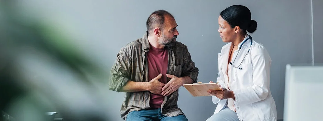 Doctor and Patient Engaged in a Medical Consultation at Hospital. Find Hospital Indemnity Insurance.