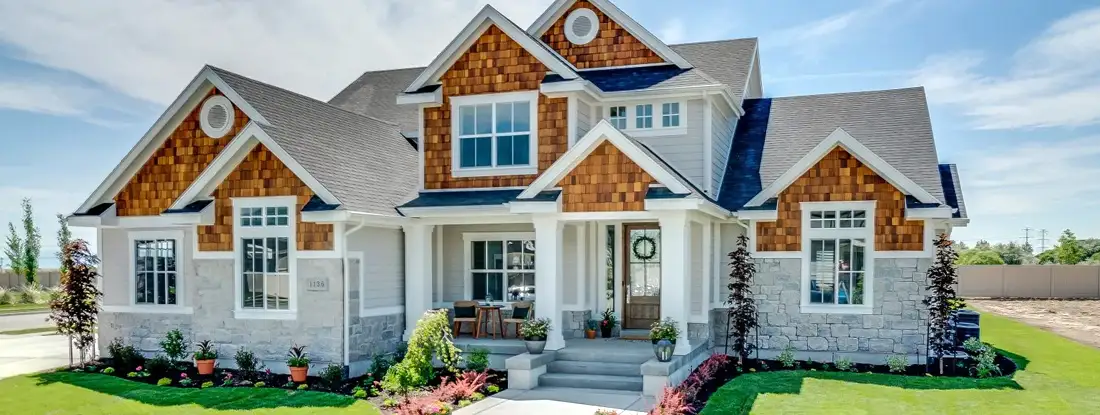 Traditional home with natural wood, siding and stone exterior. How to buy homeowners insurance.