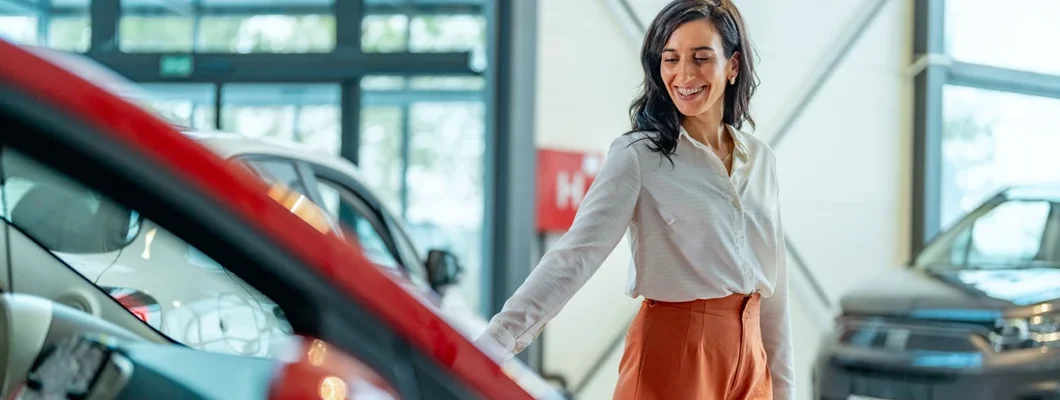 Businesswoman choosing a new car. What you should pay for a new car.