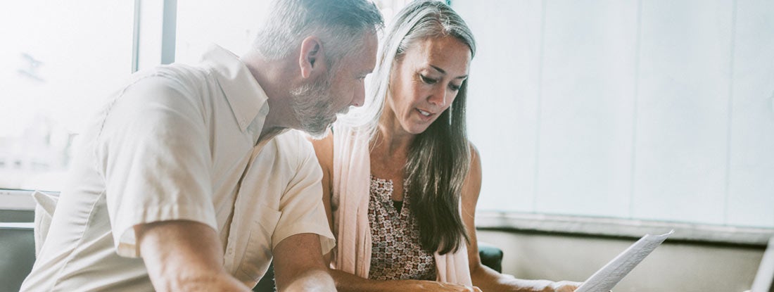 Couple reviewing documents together. Are fixed annuities risky?