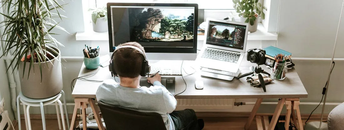 Digital artist working in their home studio. Find Alabama Errors and Omissions Insurance. 