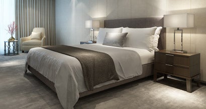 Contemporary modern luxury hotel bedroom. Find hotel insurance.
