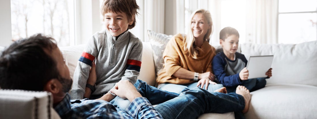 Family at home. Find Texas Life Insurance.