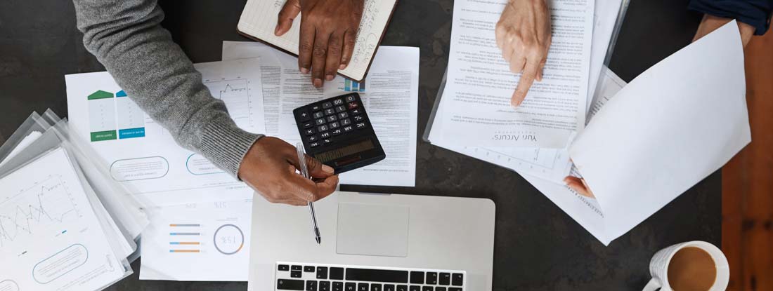 Senior couple working on their finances at home. How Are Annuities Taxed?