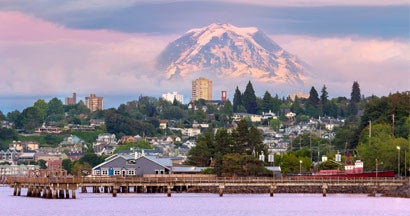 Mount Rainier over Tacoma WA waterfront during sunset evening