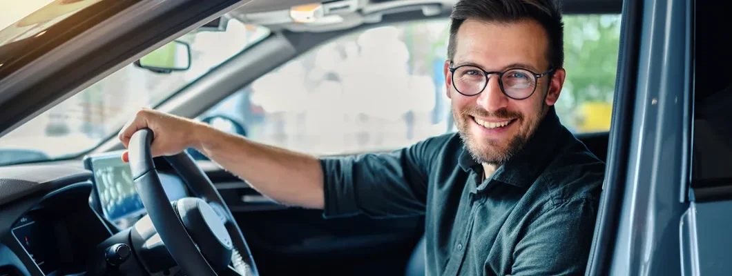 Happy customer buying a new car. Pros and Cons of Buying a Car with Cash.