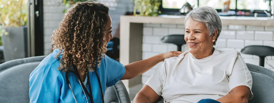 What Is a Health Savings Account?  Healthcare professional talking to patient at home.