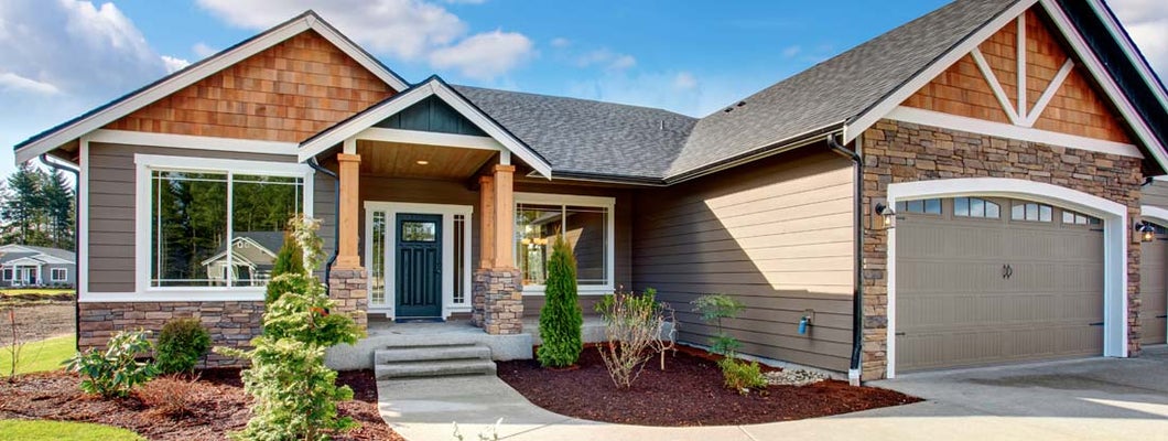 Large modern house with stone and walkway.  Find Walpole Massachusetts Homeowners Insurance.