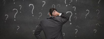 A man scratches his head with nothing but questions.