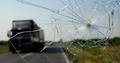 Inside of the car with windshield that was broken in car accident.  Find Comprehensive Insurance.