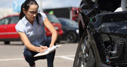 Insurance agent records damage to car after accident. Everything You Need to Know About CPI Insurance.