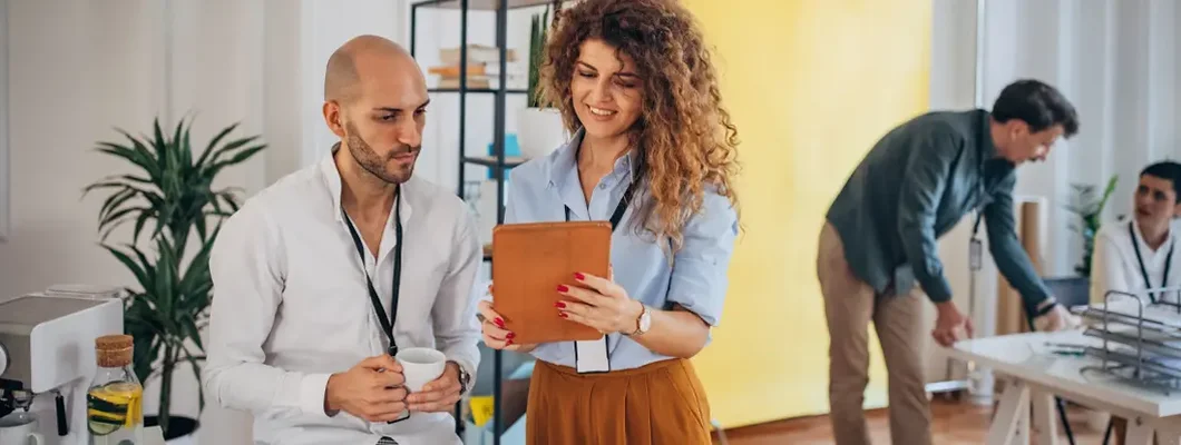 People working together in modern office. Find New Canaan, Connecticut business insurance.