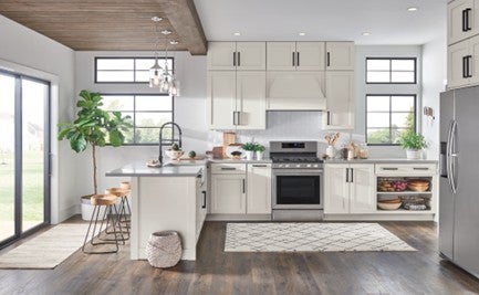 Open style kitchen with white, modern cabinets