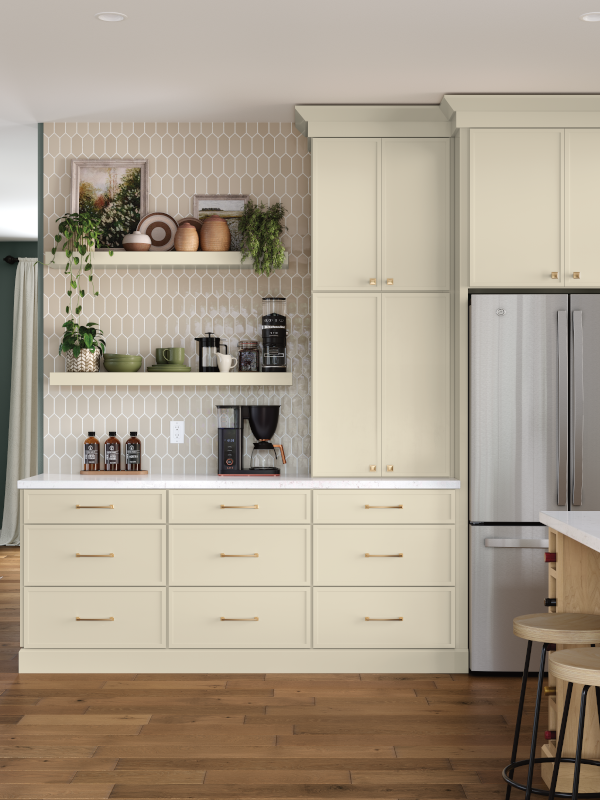 Off-white kitchen cabinets with a dedicated coffee station with open shelving, drawers, and a pantry.