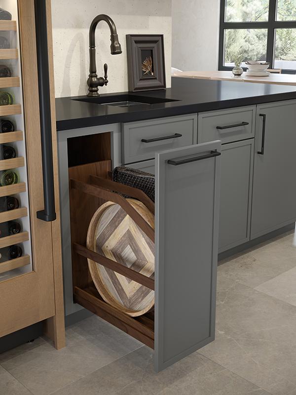A base cabinet with a cookie sheet divider in a roll tray.