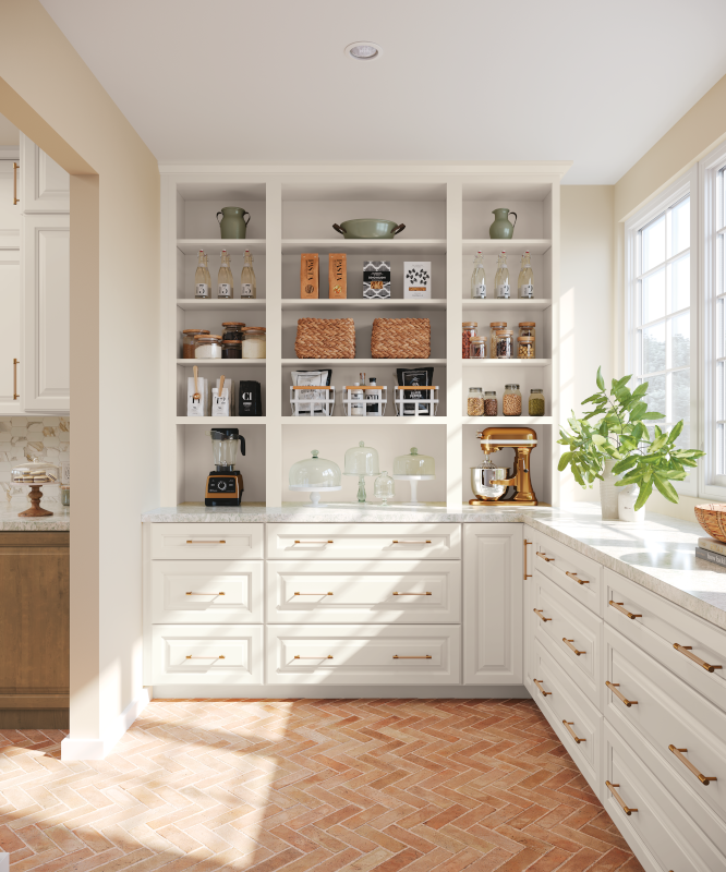 A butler's pantry with white cabinet drawers, organized kitchen appliances on open shelving, and ample natural lighting streaming in from the windows. 