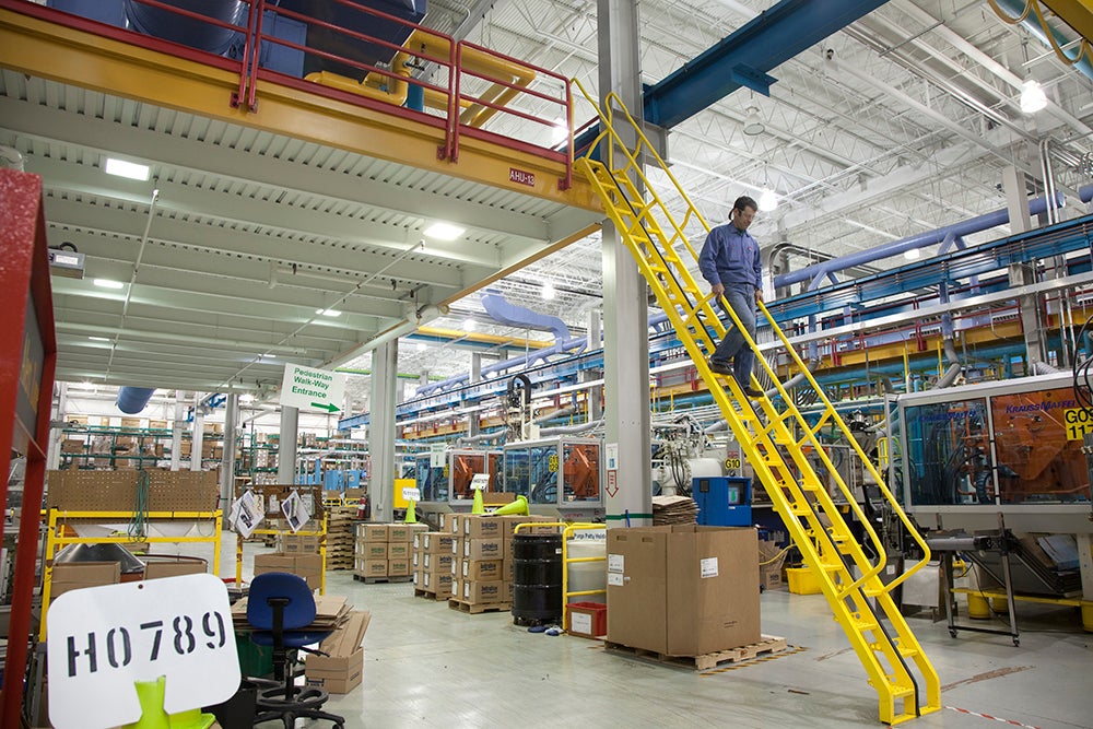 Man walking down alternating tread stairs 