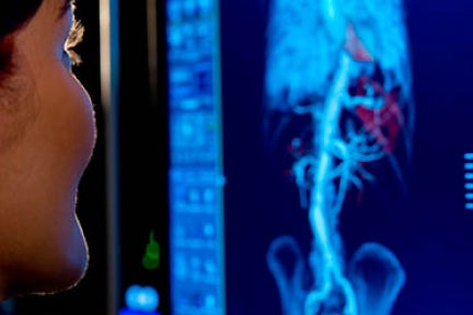 Woman looking at screens