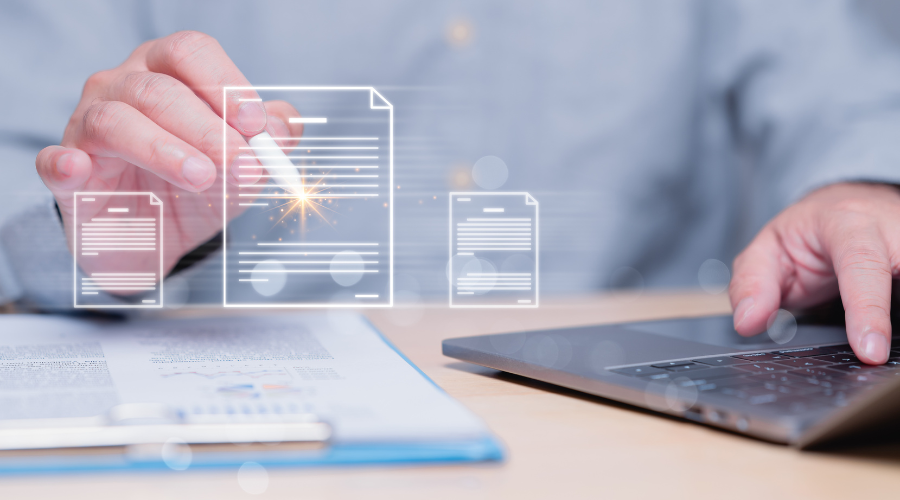 Person using a laptop and interacting with digital document icons.