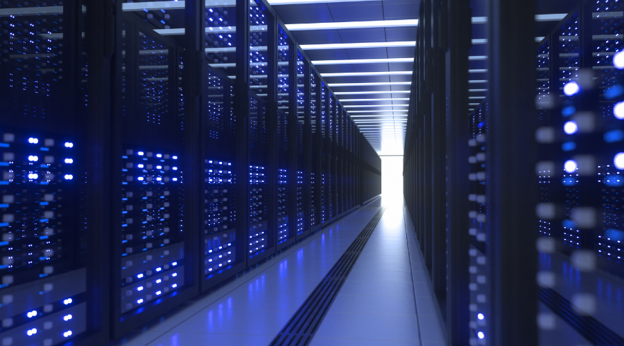 A blue data center aisle with rows of illuminated server racks.