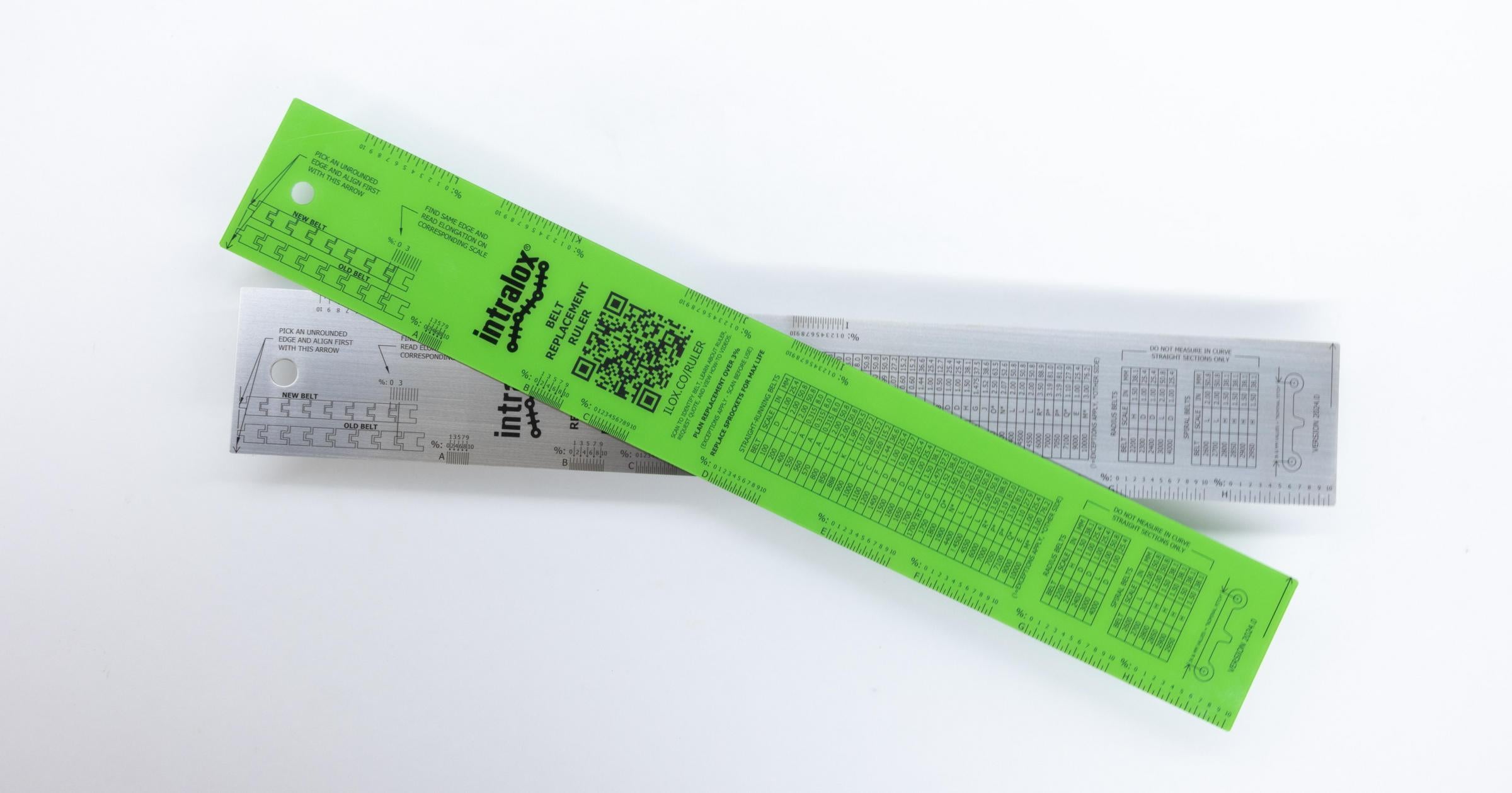 Green Belt Replacement Ruler stacked atop a metal Belt Replacement Ruler