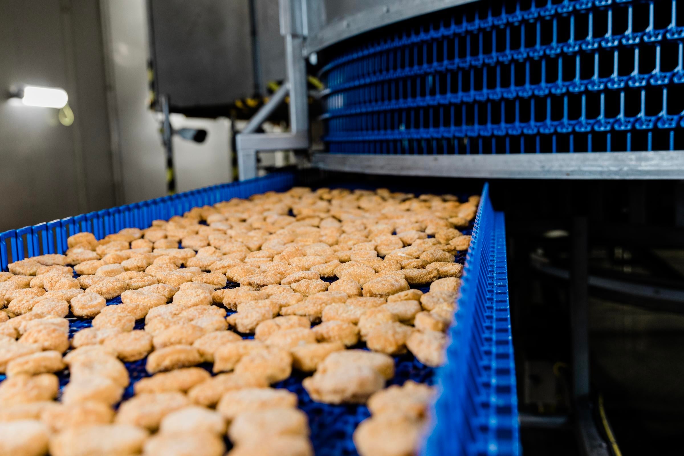 Chicken nuggets exiting a DirectDrive Stacker